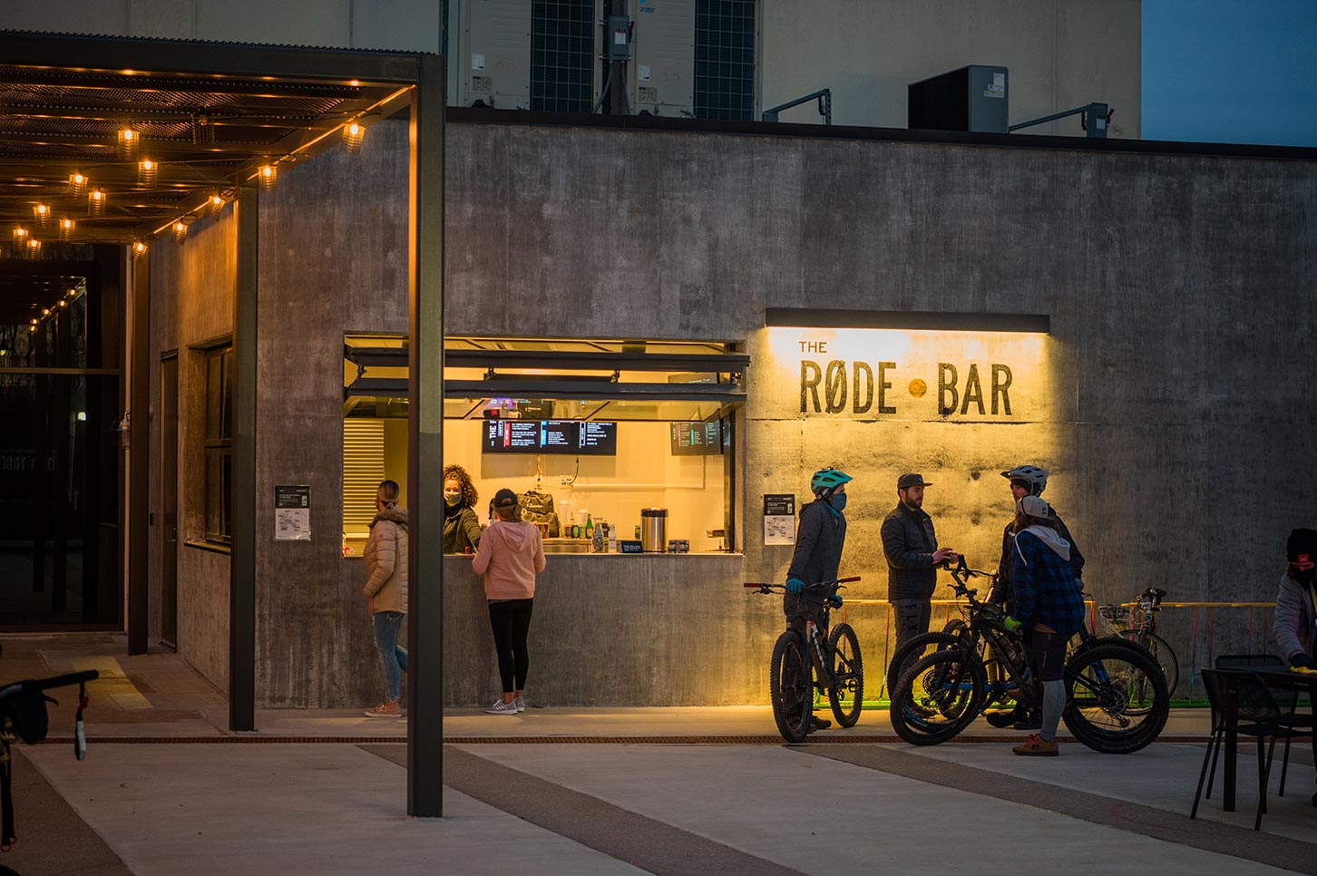 People outside of the RODE bar at dusk