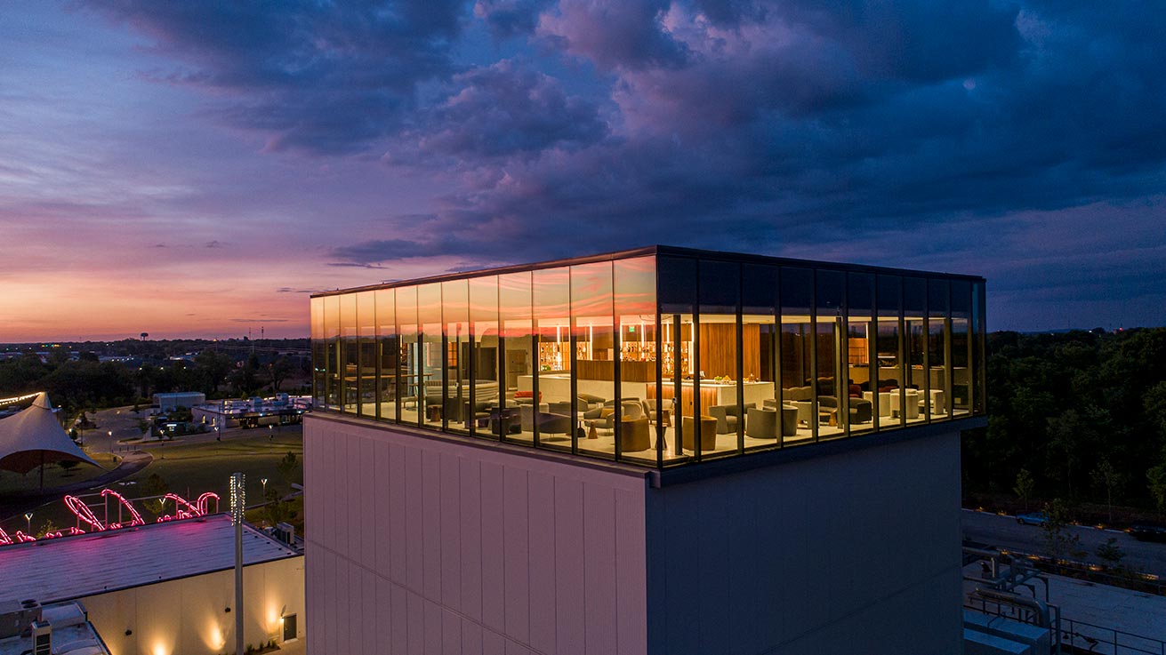 Exterior of enclosed roof top bar at night