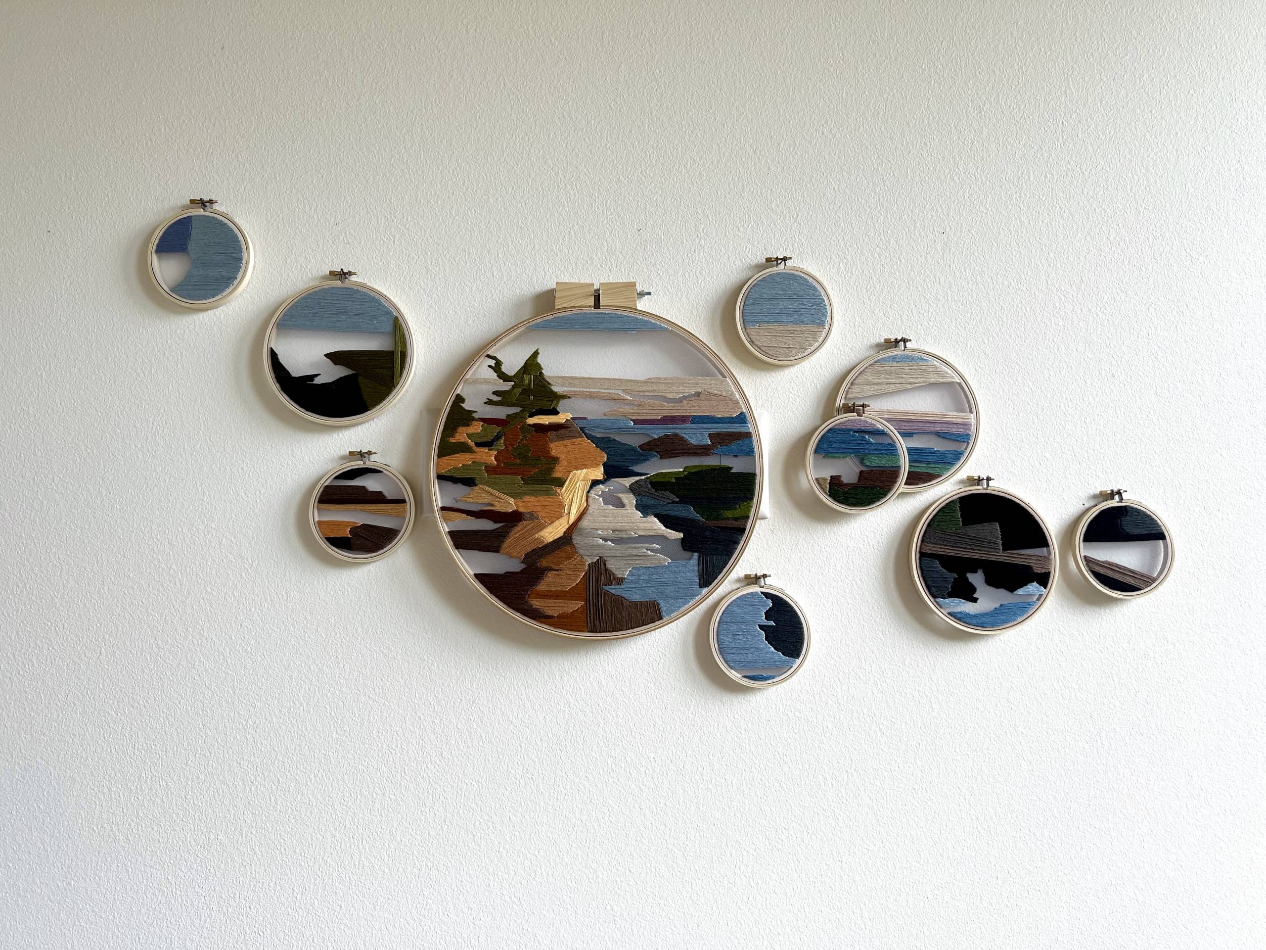 Thread paintings by Claire Pongonis A collection of colorful thread paintings in circular frames by Claire Pongonis