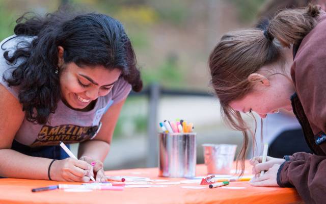 teen girls making art outside