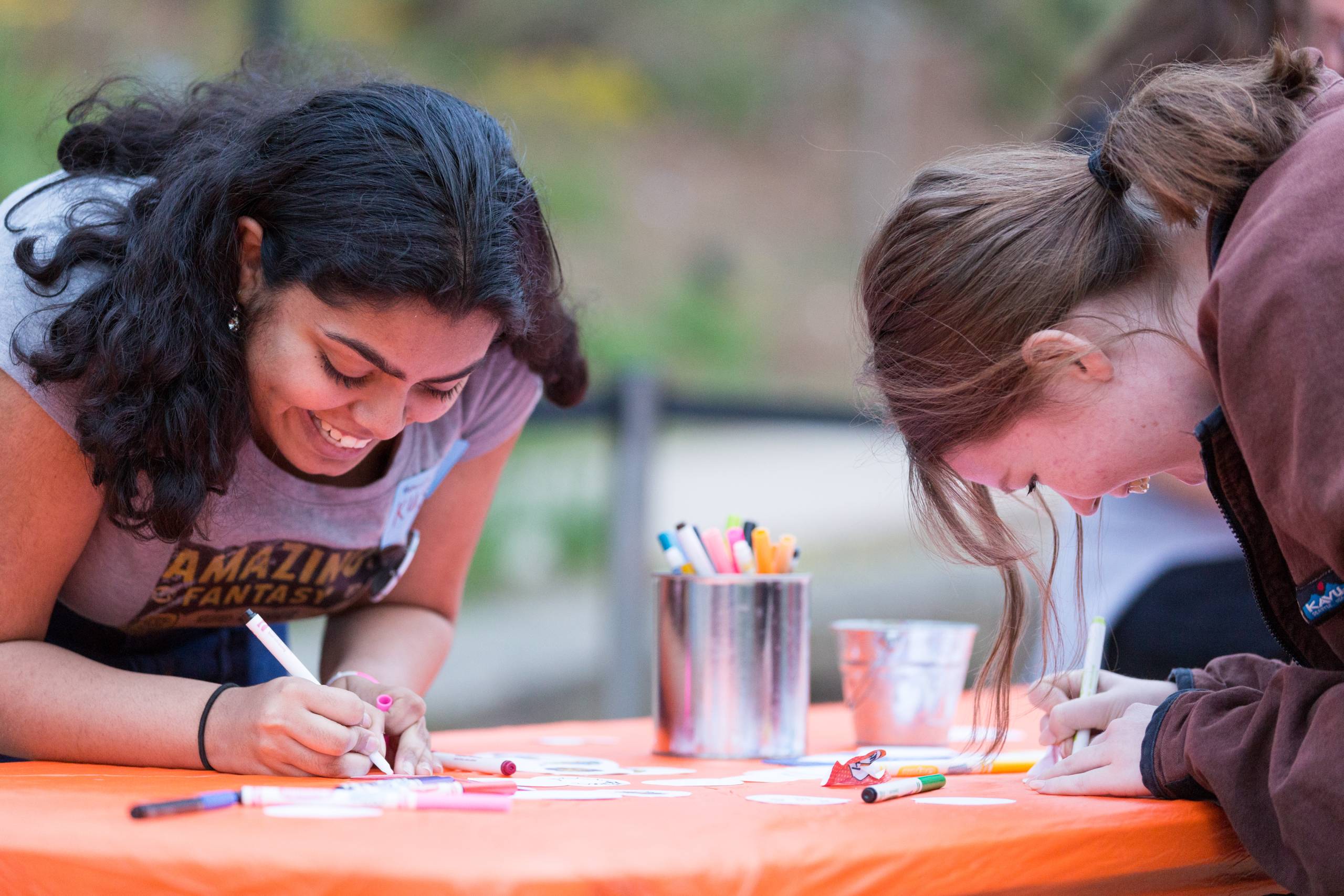 teen girls making art outside