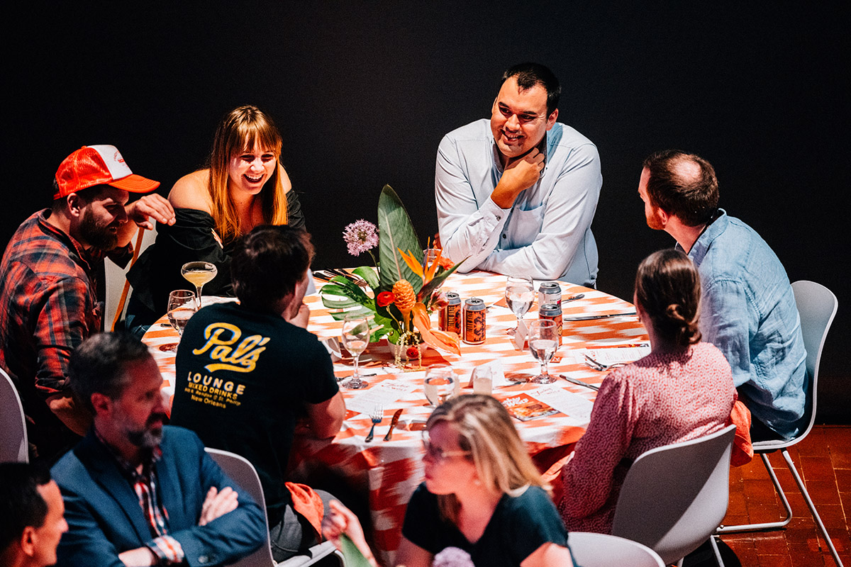 People sitting around a table talking.