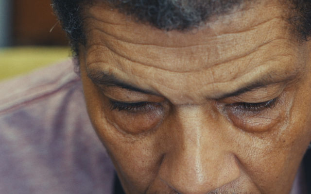 Film poster for "Brush Strokes" by Obed Lamy, showing an older man's thoughtful expression.